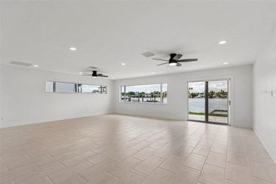 Price Improvement! Experience the pinnacle of refined waterfront - photo 9
