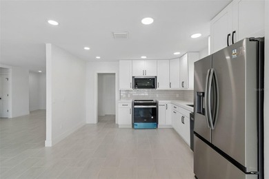 Price Improvement! Experience the pinnacle of refined waterfront - photo 10