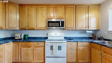 Three bedrooms and a spacious two-level layout set the tone for - photo 10