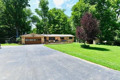 Tucked away on a quiet lot that COMBINES a spacious lawn with a - photo 1