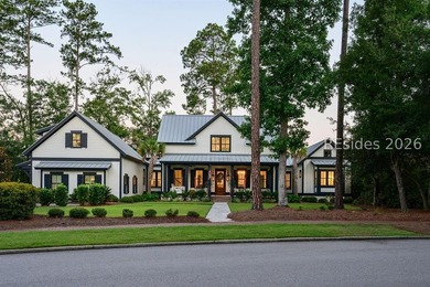 Gracefully positioned on a half-acre homesite overlooking one of - photo 1