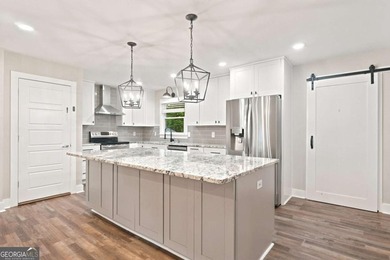 Welcome home to this beautifully renovated 3-bedroom, 2-bathroom - photo 12