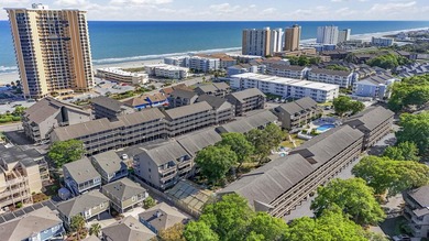 Just a short walk to the beach, this updated 2-bedroom, 2-bath - photo 2