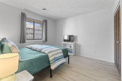 Just a short walk to the beach, this updated 2-bedroom, 2-bath - photo 6