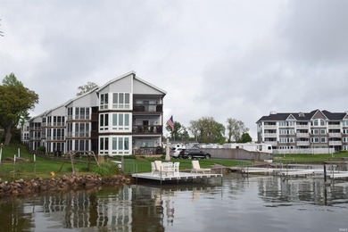 MOVE-IN READY CONDO ON WAWASEE LAKEFRONT IN ONE OF THE MOST COST - photo 1