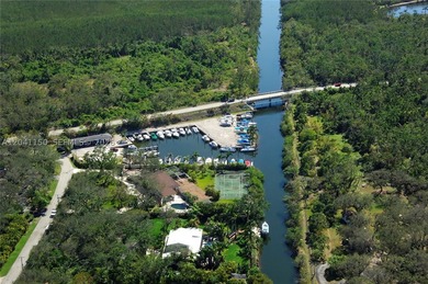 Set on approximately 1.75 acres within the gated community of - photo 15
