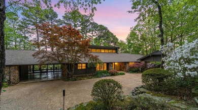 Private drive off a gated road leads to this home tucked among - photo 1