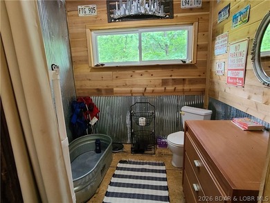 Featuring five acres of wooded privacy and a rustic cabin. Enjoy - photo 27