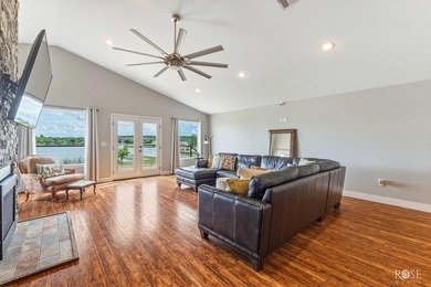 Nestled on an owned lot along the shores of Lake Nasworthy, this - photo 12