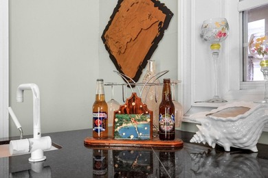 From the moment you arrive, this home tells a story. Over the - photo 25