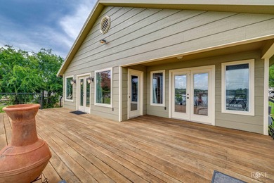 Nestled on an owned lot along the shores of Lake Nasworthy, this - photo 26