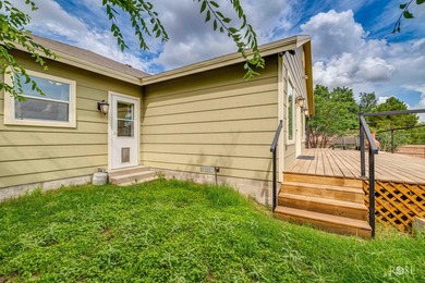 Nestled on an owned lot along the shores of Lake Nasworthy, this - photo 27
