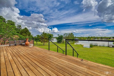 Nestled on an owned lot along the shores of Lake Nasworthy, this - photo 28