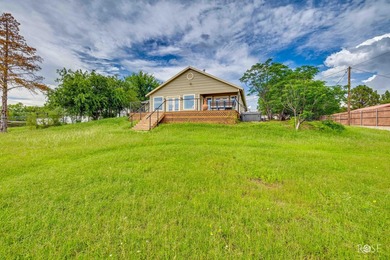 Nestled on an owned lot along the shores of Lake Nasworthy, this - photo 29