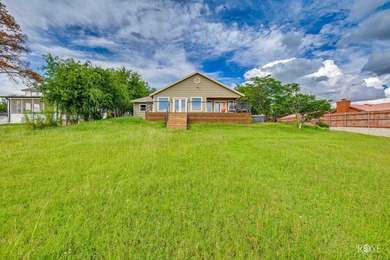 Nestled on an owned lot along the shores of Lake Nasworthy, this - photo 30