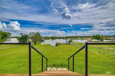 Nestled on an owned lot along the shores of Lake Nasworthy, this - photo 31