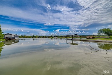 Nestled on an owned lot along the shores of Lake Nasworthy, this - photo 33