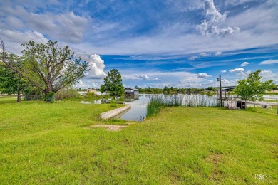 Nestled on an owned lot along the shores of Lake Nasworthy, this - photo 34