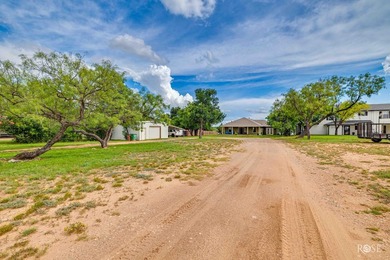 Nestled on an owned lot along the shores of Lake Nasworthy, this - photo 36
