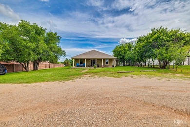 Nestled on an owned lot along the shores of Lake Nasworthy, this - photo 37