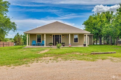 Nestled on an owned lot along the shores of Lake Nasworthy, this - photo 40