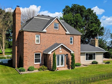 This stately brick home is a rare blend of timeless elegance - photo 1
