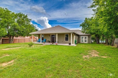 Nestled on an owned lot along the shores of Lake Nasworthy, this - photo 41