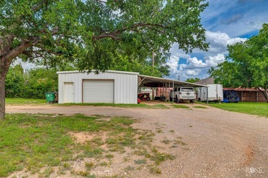 Nestled on an owned lot along the shores of Lake Nasworthy, this - photo 42