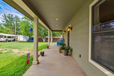 Nestled on an owned lot along the shores of Lake Nasworthy, this - photo 43