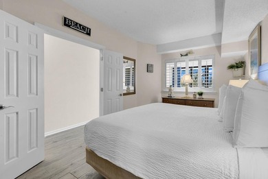 Welcome to Unit 207 at Beach Colony Resort, a charming 1-bedroom - photo 9