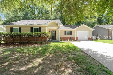 Welcome to this charming 4-bedroom, 2-bath home in the - photo 1