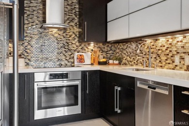 Residence 1001 at historic Hills Plaza is a warm, light-filled - photo 14