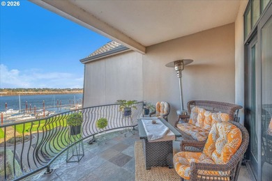 Experience elevated riverfront living in this top-floor