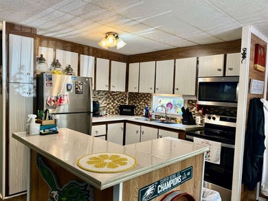 Welcome home to the corner-lot retreat in the desirable Ocean - photo 4