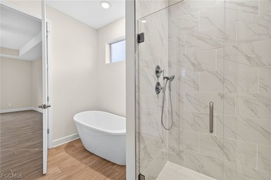 SW Cape New Construction Pool Home | Two luxurious primary - photo 10