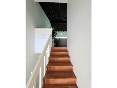 This top-floor end-unit townhome offers a spacious living room - photo 6