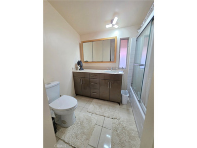 This top-floor end-unit townhome offers a spacious living room - photo 7