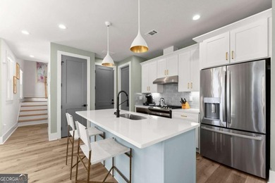 Rare primary-on-main townhome with a two-car garage just steps - photo 9