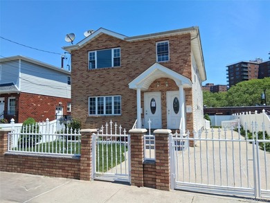 Welcome to this spacious two-family home nestled in the heart of - photo 1