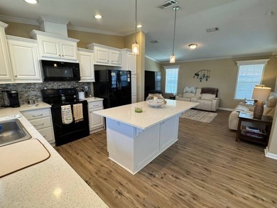This 2018 home features 3 bedrooms, 2 baths, and a charming - photo 12