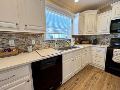 This 2018 home features 3 bedrooms, 2 baths, and a charming - photo 15
