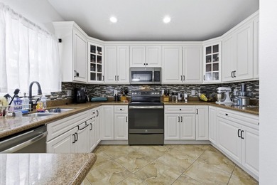 Wel maintained 3BR/2BA home with a 2 car garage in the gated - photo 11