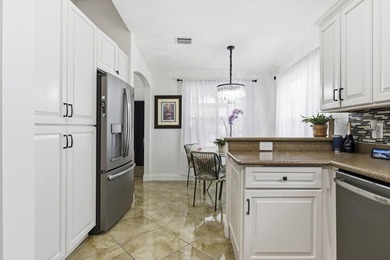 Wel maintained 3BR/2BA home with a 2 car garage in the gated - photo 12