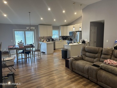 Totally renovated 2023. Open kitchen/living room floor plan with - photo 8