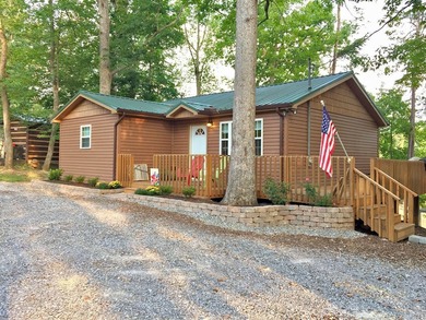 Move in ready lake cabinpletely remodeled with flooring - photo 1