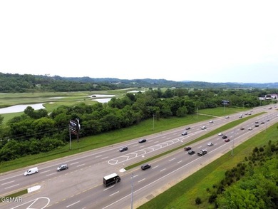 7.61+/- Acres, 1,912' of frontage on Winfield Dunn Parkway, Hwy - photo 3