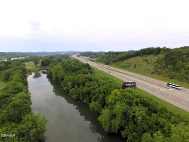 7.61+/- Acres, 1,912' of frontage on Winfield Dunn Parkway, Hwy - photo 4