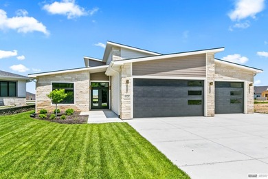Wow! Sleek and modern 3 bed, 3 bath, 3 car ranch boasting 9 ft - photo 1