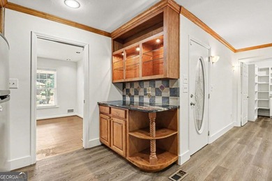 This charming split-level home with a rocking chair front porch - photo 11