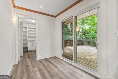 This charming split-level home with a rocking chair front porch - photo 12